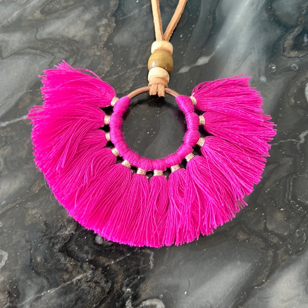 Fuscia pendant on leather cord